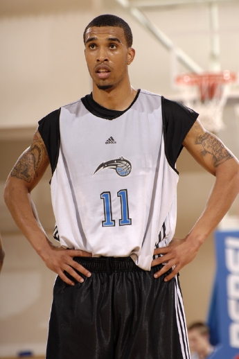 Courtney Lee of the Orlando Magic stands with his hands on his hips during a break in summer-leage play.
