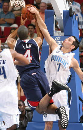 Orlando Magic guard J.J. Redick blocks the shot of Atlanta Hawks guard Acie Law IV in an NBA exhibition basketball game on October 6th, 2008