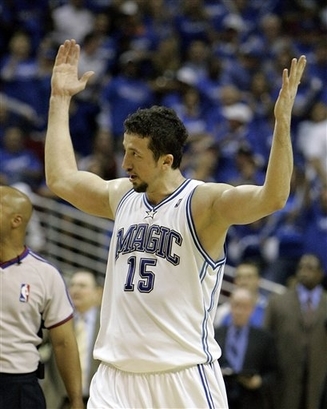 Hedo Turkoglu of the Orlando Magic encourages the fans at the Amway Arena to cheer during the final minutes of the Magic's 102-92 win over the Toronto Raptors on Monday night.