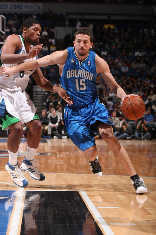 Hedo Turkoglu of the Orlando Magic drives past Ryan Gomes of the Minnesota Timberwolves during their NBA basketball game on December 27t, 2008