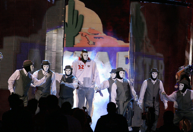 Shaquille O'Neal of the Western Conference All-Stars dances with the Jabbawockeez during the pre-game introductions at the 2009 NBA All-Star Game in Phoenix, Arizona